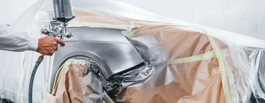 Worker repairing car